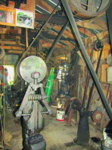 blacksmithing equipment and pulleys.